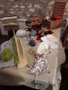Display of seventeenth century textile crafts created by the Friends craft group.