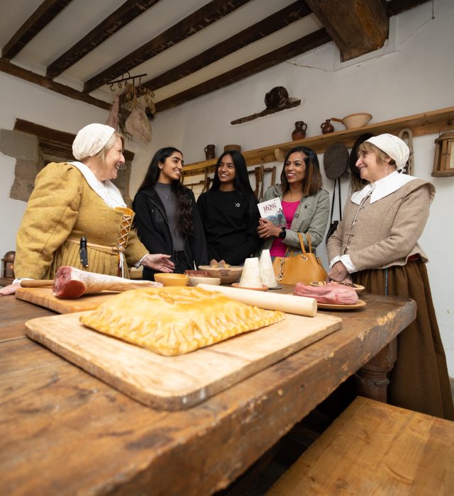 Costumed House Volunteers With A Family In The Scullery Scaled Aspect Ratio 640 700